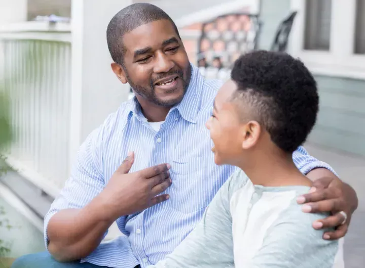 dad and son talk together