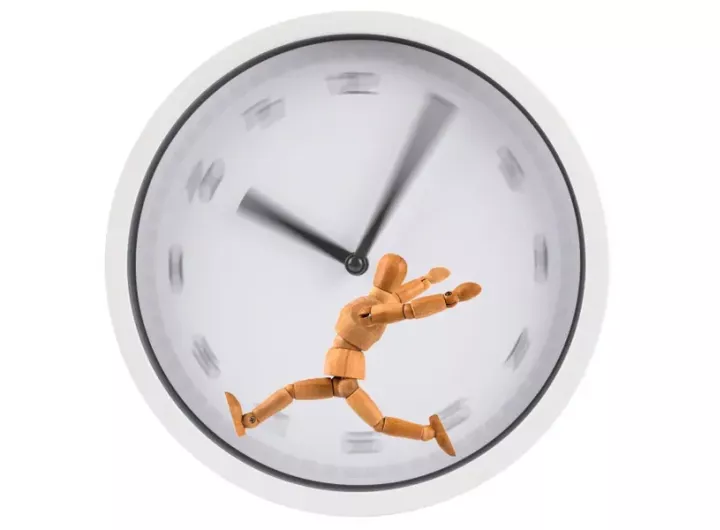 figure running on a hamster-wheel type blurry clockface